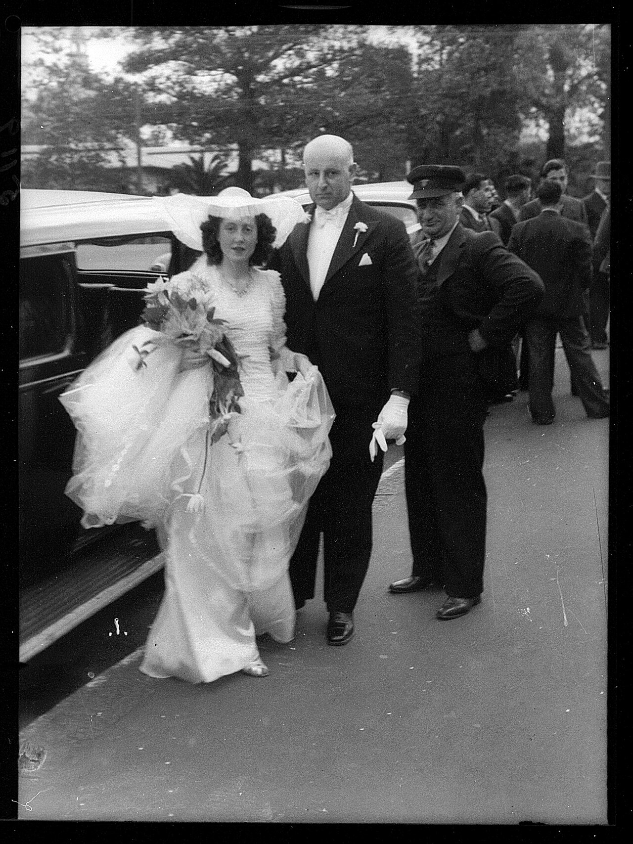 Archival photograph of a bride with her father