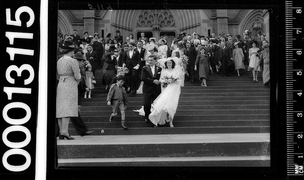 Archival photograph of a bride and groom leaving a cathedral